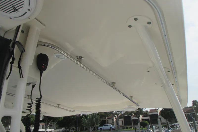  Yacht Photos Pics 2013 Pursuit ST 310 Sport boat interior with speaker and microphone setup.