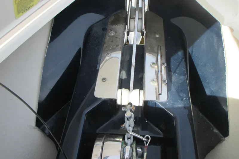  Yacht Photos Pics Anchor system of 2013 Pursuit ST 310 Sport boat, featuring chain and roller mechanism.