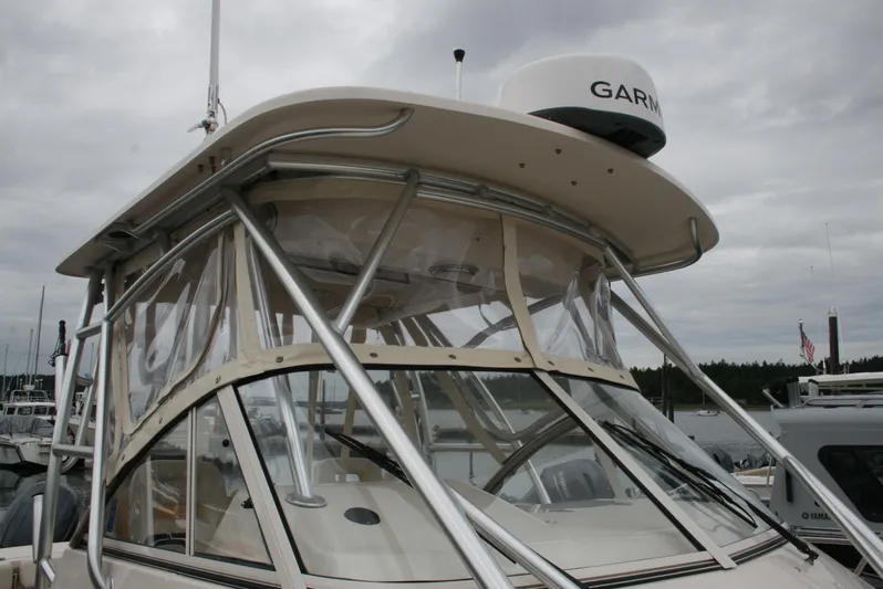  Yacht Photos Pics 2020 Grady-White Gulfstream 232 boat with Garmin radar, docked under cloudy skies.