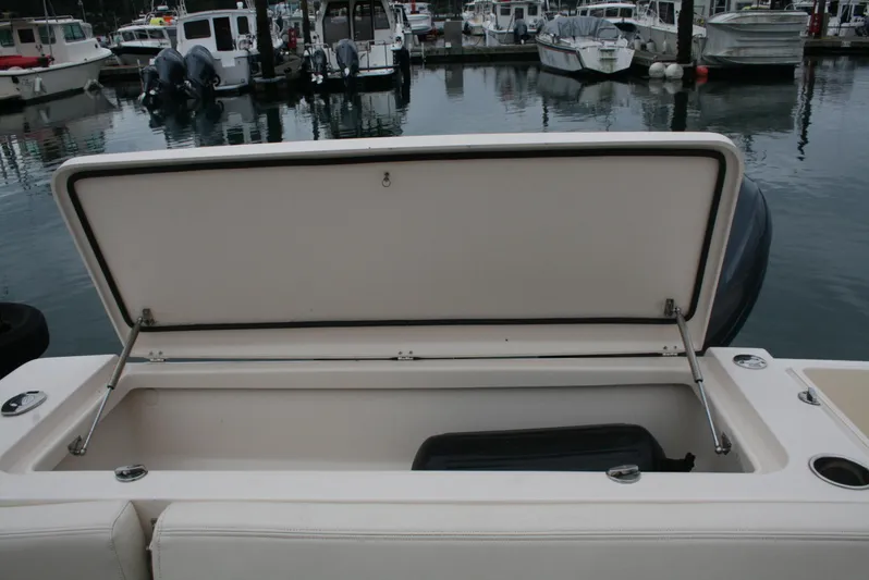  Yacht Photos Pics Open storage compartment on a 2020 Grady-White Gulfstream 232 boat at a marina.