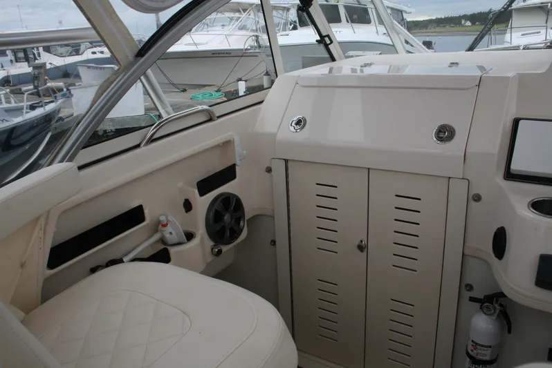  Yacht Photos Pics Interior of a 2020 Grady-White Gulfstream 232 boat, featuring seating and storage compartments.
