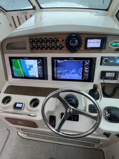  Yacht Photos Pics 2014 Grady-White Freedom 375 helm with navigation screens and controls.