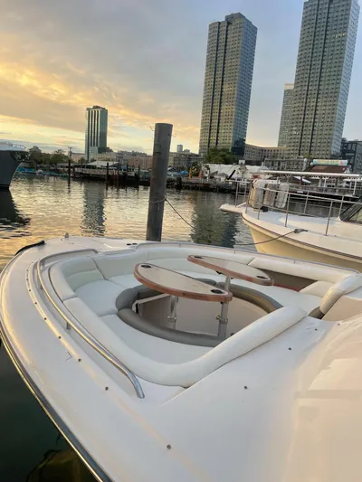  Yacht Photos Pics 2014 Grady-White Freedom 375 boat docked with city skyline in background.