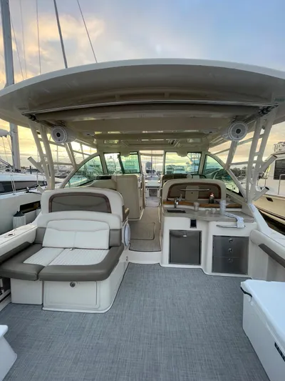  Yacht Photos Pics 2014 Grady-White Freedom 375 boat interior with seating and helm station.