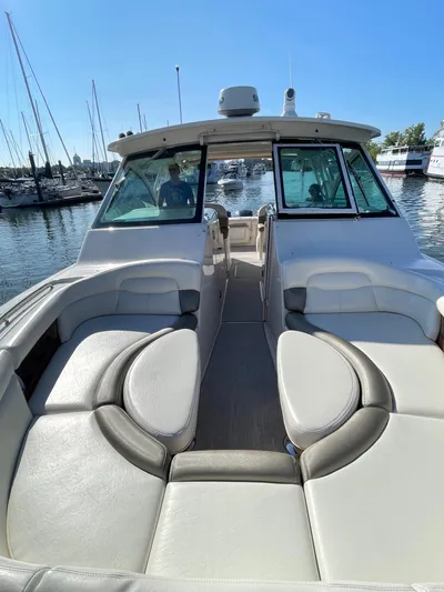  Yacht Photos Pics 2014 Grady-White Freedom 375 boat with spacious seating at a marina.