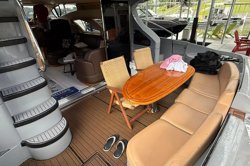  Yacht Photos Pics Luxurious 2006 Azimut 50 yacht interior with seating, table, and staircase.