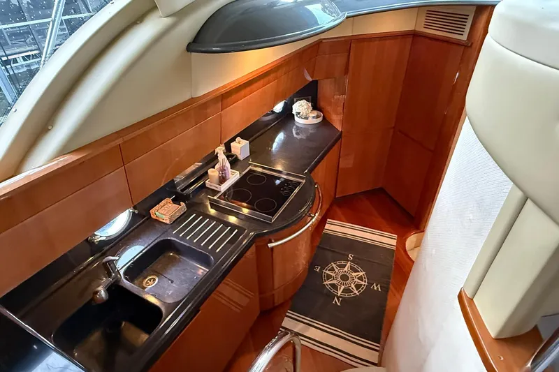  Yacht Photos Pics Luxurious kitchen interior of 2006 Azimut 50 yacht with modern amenities and sleek design.