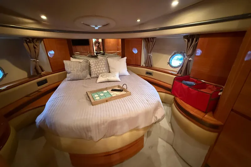  Yacht Photos Pics Luxurious cabin interior of a 2006 Azimut 50 yacht with cozy bedding and elegant decor.