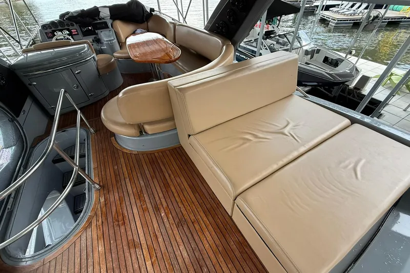  Yacht Photos Pics Luxurious 2006 Azimut 50 yacht interior with leather seating and wooden flooring.