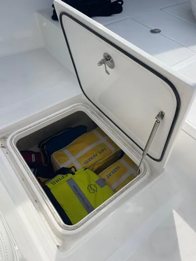  Yacht Photos Pics Open storage compartment on 2013 Bahama 41 Open boat with life jackets inside.