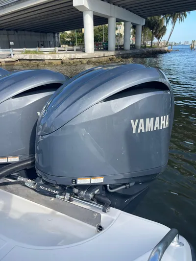  Yacht Photos Pics Twin Yamaha outboard motors on a 2013 Bahama 41 Open boat under a bridge.