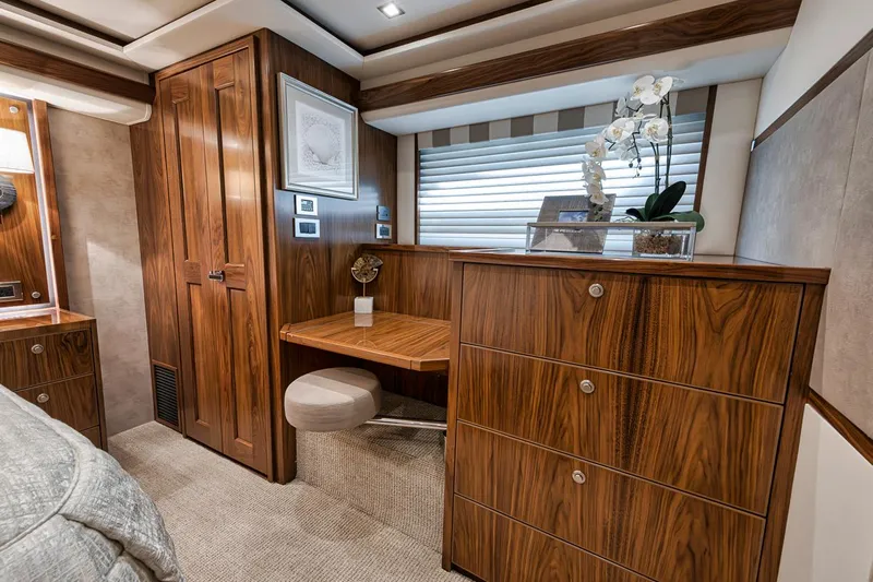 Lucky Wave Yacht Photos Pics Luxurious interior of 2021 Viking 80 Convertible yacht with elegant wood finish and modern decor.