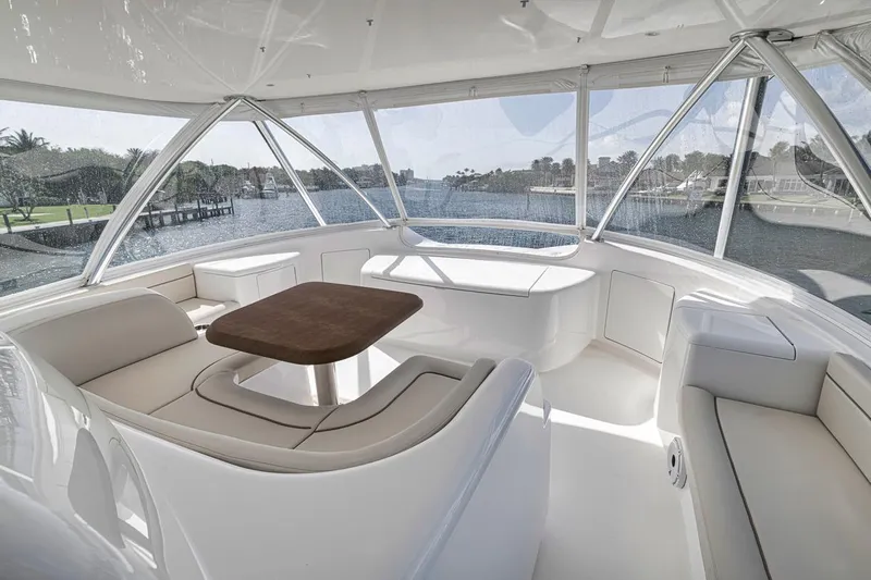 Lucky Wave Yacht Photos Pics Luxurious interior of 2021 Viking 80 Convertible yacht with elegant seating and scenic views.