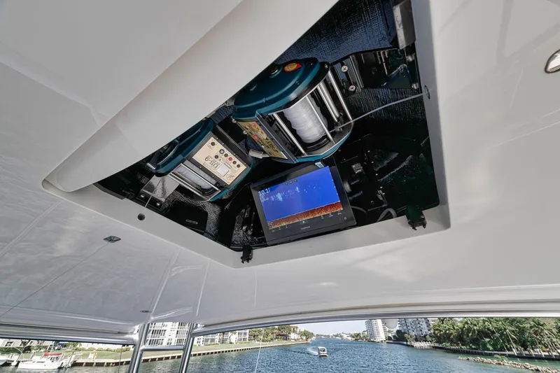 Lucky Wave Yacht Photos Pics 2021 Viking 80 Convertible yacht with advanced electronic equipment and scenic waterway view.