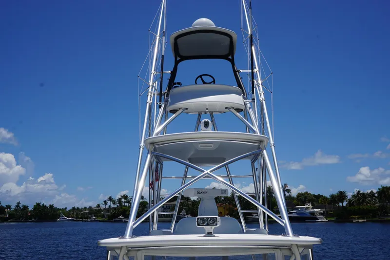  Yacht Photos Pics 2015 SeaVee 430 FA boat tower against a clear blue sky and waterfront backdrop.
