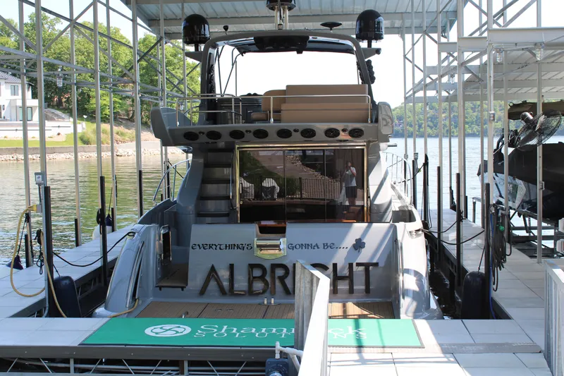  Yacht Photos Pics Azimut 50 yacht docked, rear view, 2006 model, with "Albright" name visible.