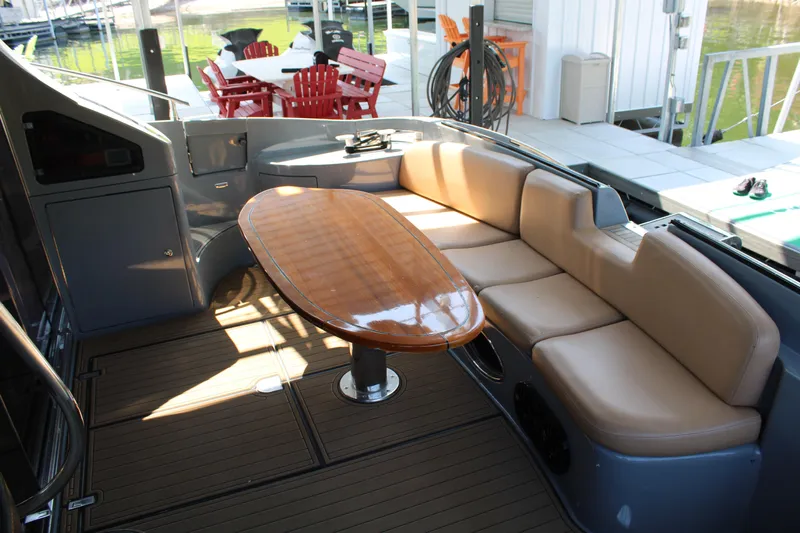  Yacht Photos Pics Luxurious seating area on a 2006 Azimut 50 yacht with a polished wooden table.