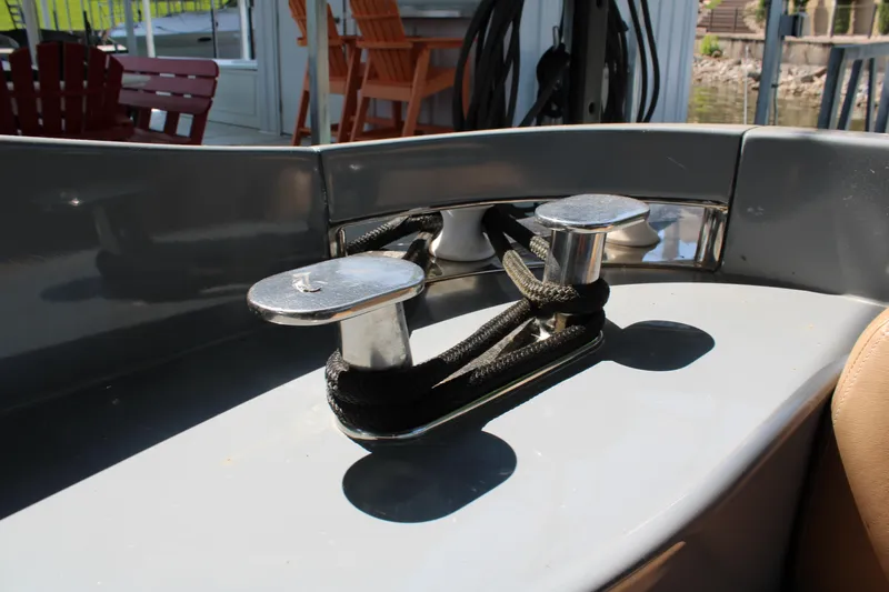  Yacht Photos Pics Cleat and rope on 2006 Azimut 50 yacht deck in sunlight.