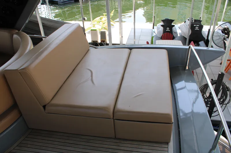  Yacht Photos Pics Luxury seating area on 2006 Azimut 50 yacht, featuring beige cushions and sleek design.