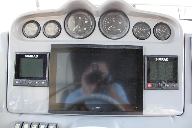  Yacht Photos Pics Control panel of a 2006 Azimut 50 yacht with Simrad and Garmin displays.