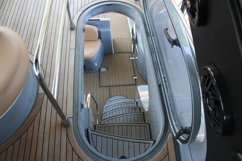  Yacht Photos Pics Staircase on 2006 Azimut 50 yacht with wooden deck and seating area.