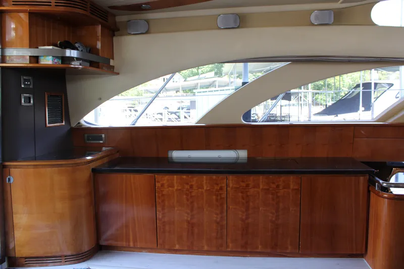  Yacht Photos Pics Interior of 2006 Azimut 50 yacht with wooden cabinetry and large windows.