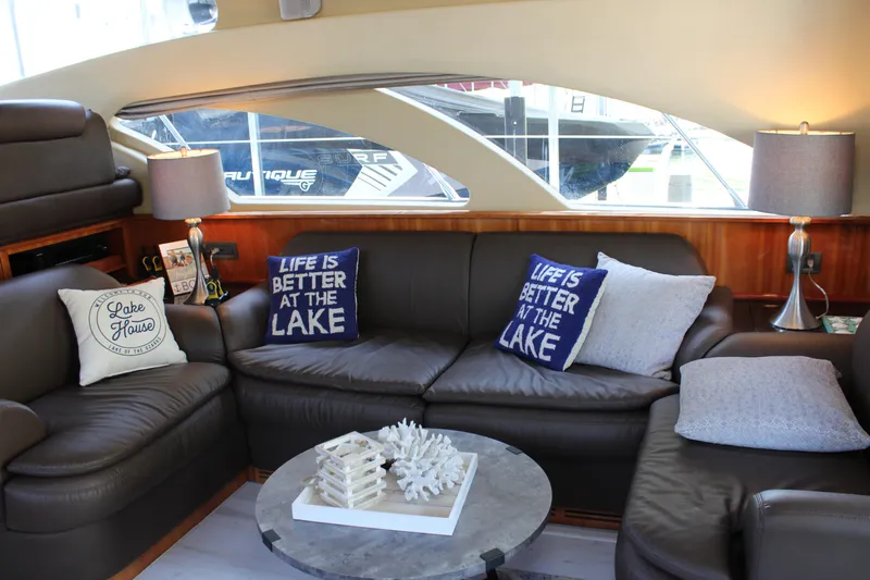  Yacht Photos Pics Luxurious 2006 Azimut 50 yacht interior with cozy leather seating and decorative pillows.