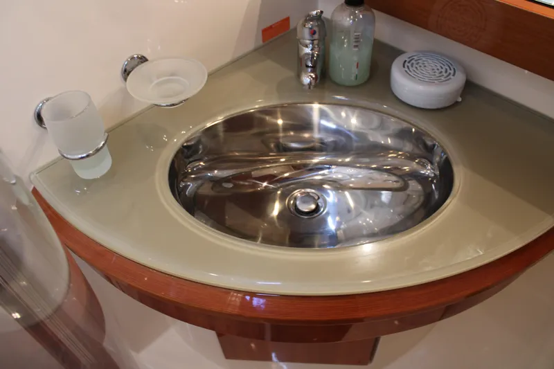  Yacht Photos Pics Luxury yacht Azimut 50 (2006) bathroom sink with modern fixtures and accessories.