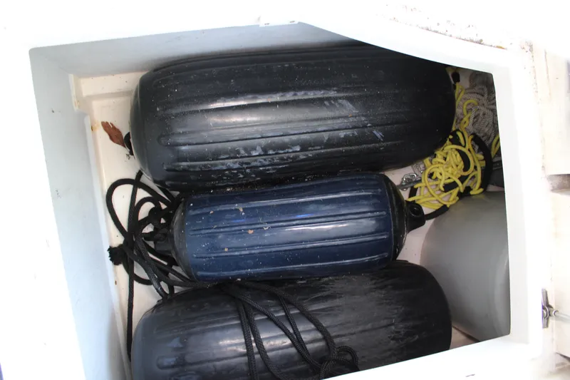  Yacht Photos Pics Storage compartment with boat fenders and ropes on a 2006 Azimut 50 yacht.