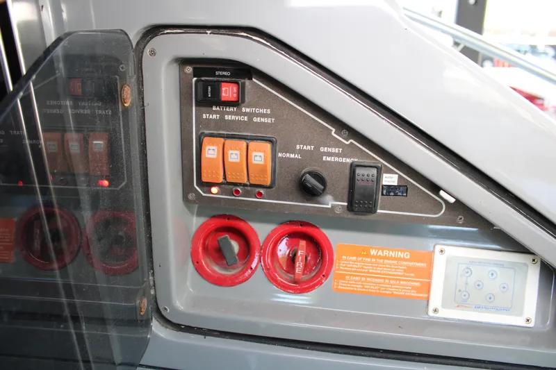  Yacht Photos Pics Control panel of a 2006 Azimut 50 yacht with switches and warning labels.