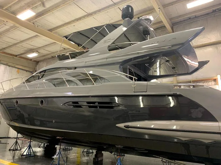 Yacht Photos Pics 2006 Azimut 50 yacht in a warehouse, showcasing sleek design and modern features.