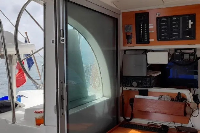 Sillage Yacht Photos Pics Interior view of a 2002 Lagoon 380 catamaran with navigation equipment and control panel.