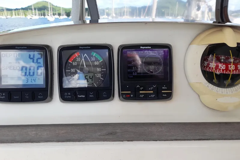 Sillage Yacht Photos Pics Lagoon 380 yacht dashboard with Raymarine instruments and compass, 2002 model.
