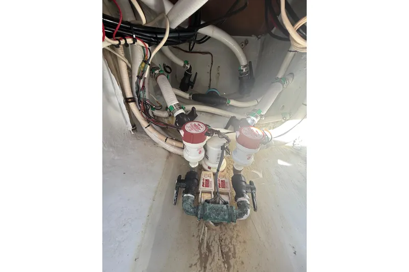  Yacht Photos Pics Bilge area of a 2003 Contender 27 Open boat with hoses and filters.