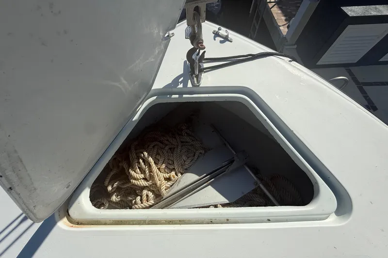  Yacht Photos Pics Open hatch on 2003 Contender 27 Open boat showing ropes and anchor.