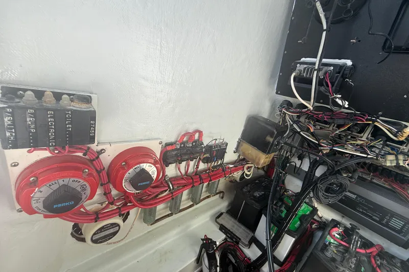  Yacht Photos Pics Electrical system of a 2003 Contender 27 Open boat, featuring wiring and switches.