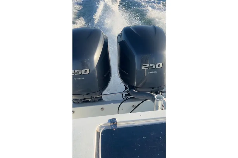  Yacht Photos Pics Twin Yamaha 250 engines on a 2003 Contender 27 Open boat in motion.