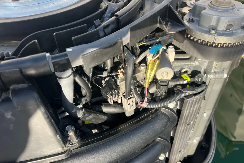  Yacht Photos Pics Close-up of a 2003 Contender 27 Open engine components and wiring.