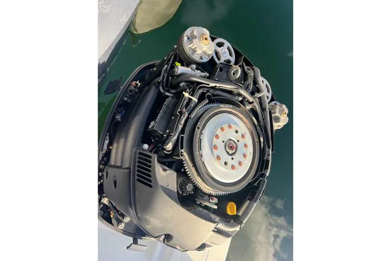  Yacht Photos Pics Close-up of a 2003 Contender 27 Open boat engine, showcasing mechanical components.