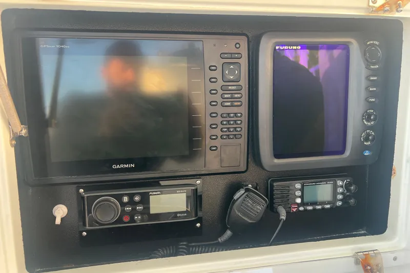  Yacht Photos Pics Control panel of a 2003 Contender 27 Open boat with Garmin and Furuno electronics.