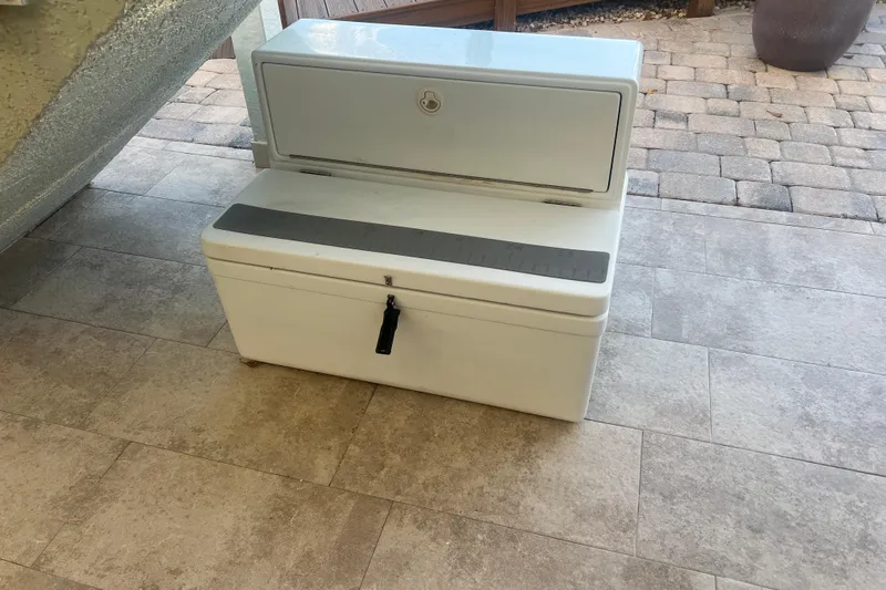  Yacht Photos Pics White storage box on tiled floor, possibly from a 2003 Contender 27 Open boat.