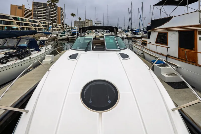 Fantasea Yacht Photos Pics 2014 Regal 32 Express yacht docked in a marina, surrounded by other boats.