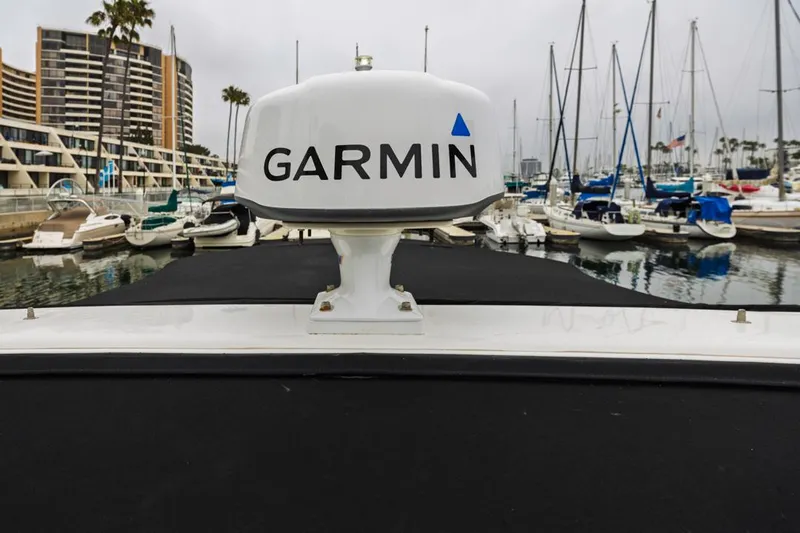 Fantasea Yacht Photos Pics 2014 Regal 32 Express with Garmin radar in a marina setting.