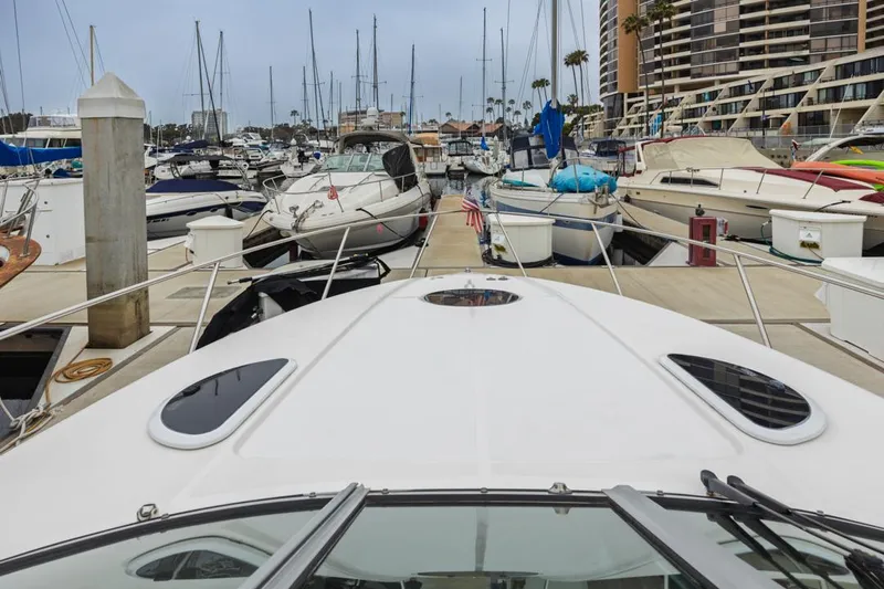 Fantasea Yacht Photos Pics 2014 Regal 32 Express yacht docked at a marina with surrounding boats.