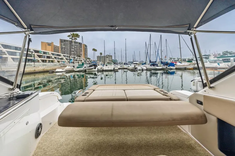 Fantasea Yacht Photos Pics 2014 Regal 32 Express boat interior with marina view, featuring a spacious seating area.