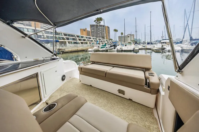 Fantasea Yacht Photos Pics 2014 Regal 32 Express boat interior with marina view, featuring comfortable seating and modern design.