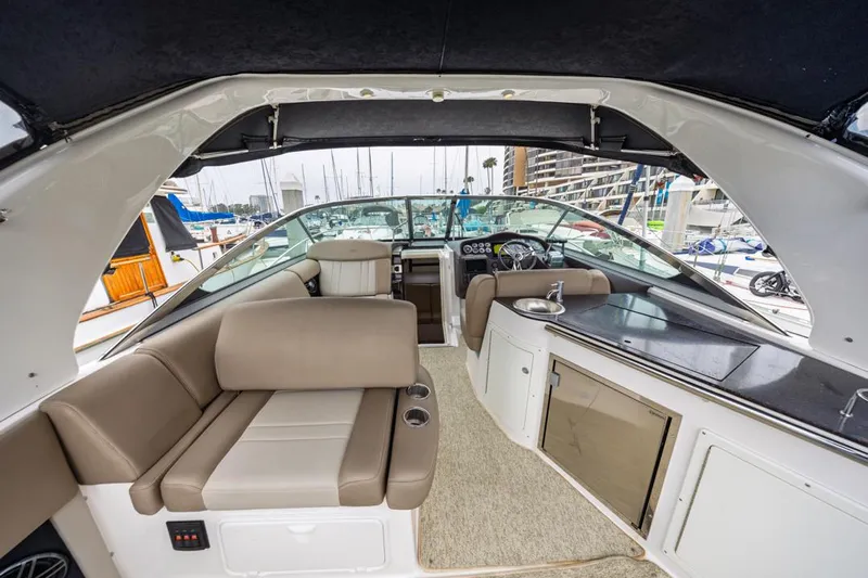 Fantasea Yacht Photos Pics Interior of a 2014 Regal 32 Express boat with seating and helm.