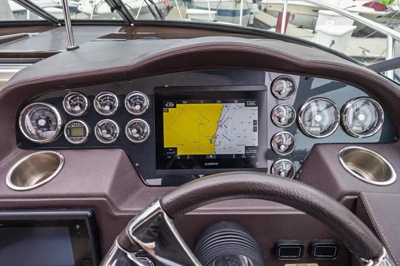 Fantasea Yacht Photos Pics Dashboard of 2014 Regal 32 Express boat with Garmin navigation system and gauges.