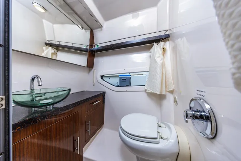 Fantasea Yacht Photos Pics Luxurious bathroom in 2014 Regal 32 Express yacht with modern fixtures and elegant design.