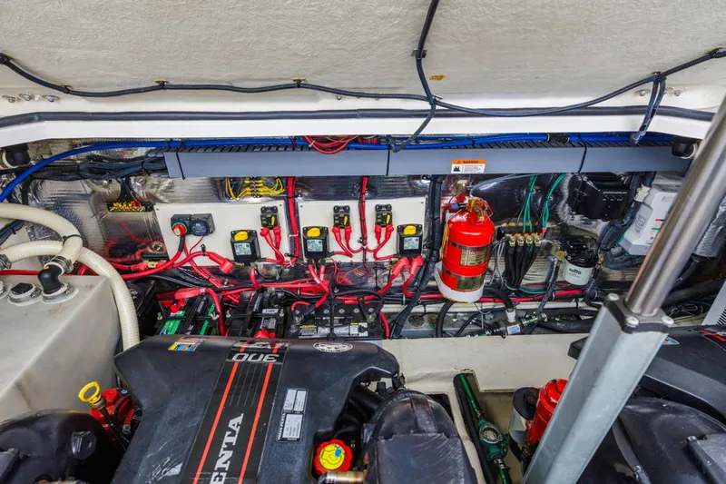 Fantasea Yacht Photos Pics Engine compartment of a 2014 Regal 32 Express boat, showcasing wiring and components.